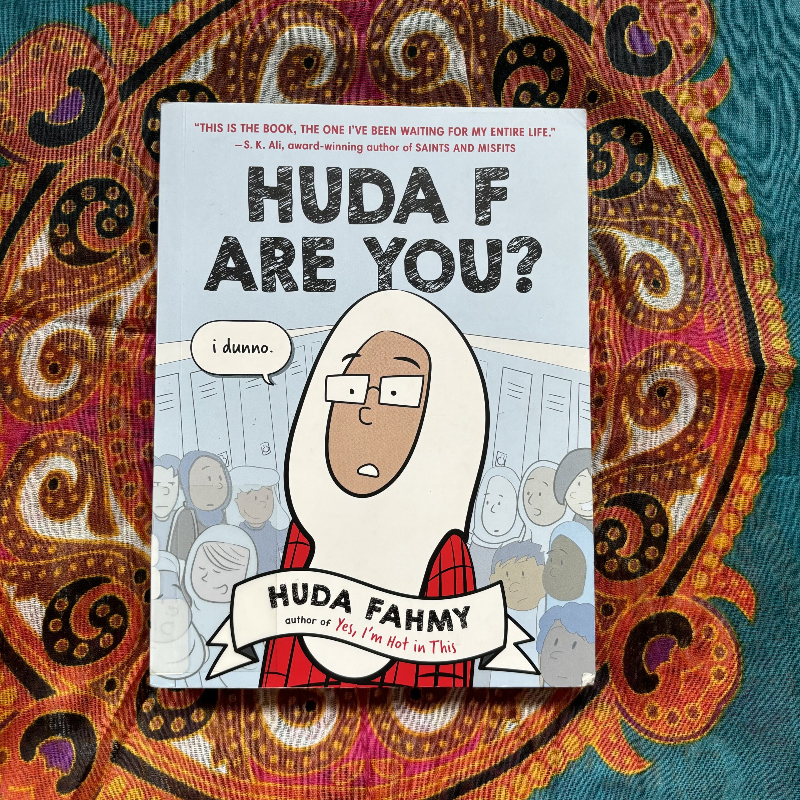 A photo of the cover of "Huda F Are You?" by Huda Fahmy